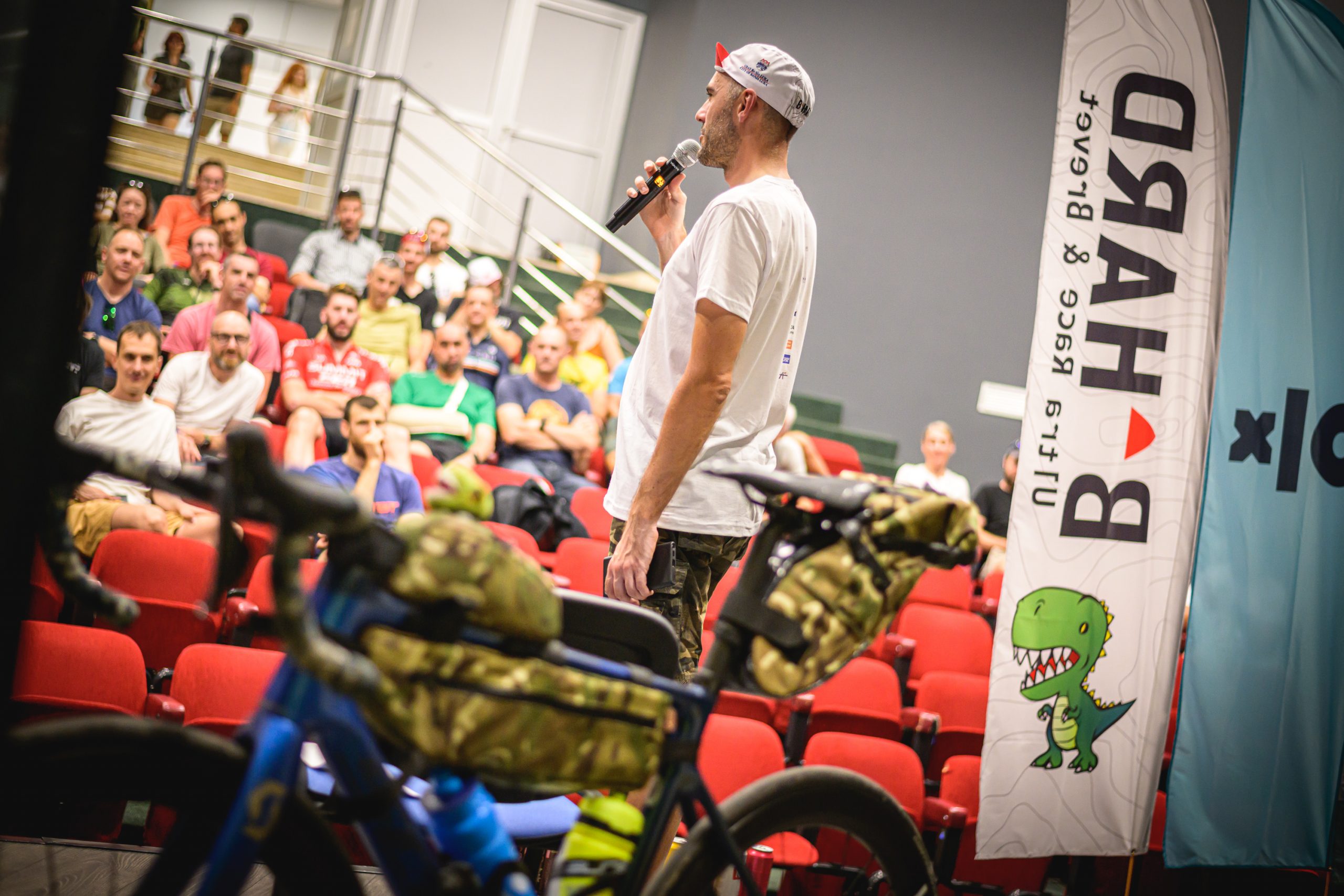 organizer talking to rider's at the briefing