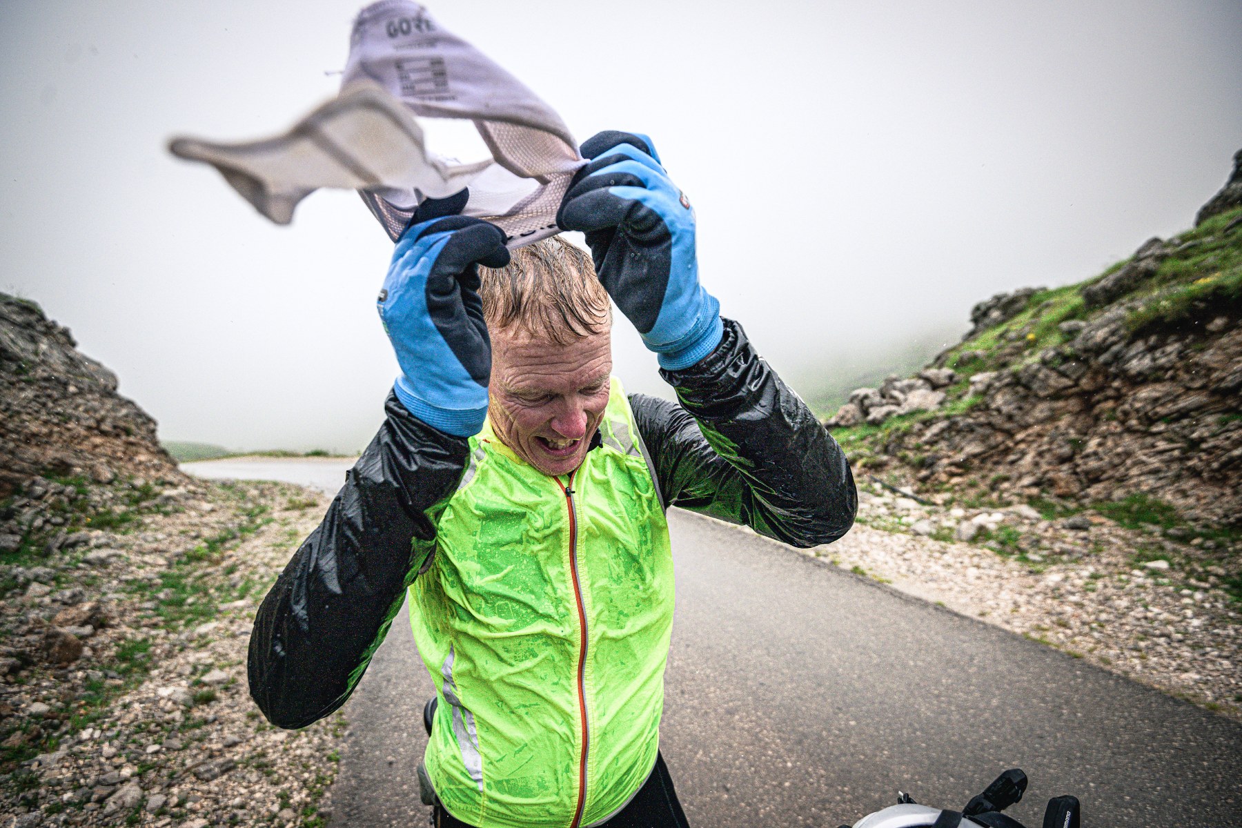 rider putting on rainproof layers